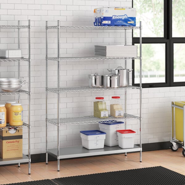 Stainless steel wire shelf unit with solid stainless steel bottom and containers on shelves.