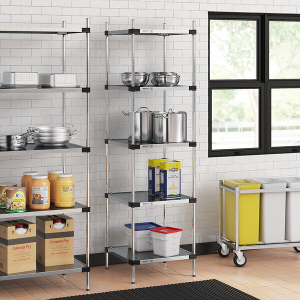 Regency galvanized steel shelves with food items in a kitchen.