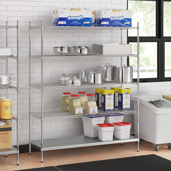 A stainless steel wire shelf kit with 5 shelves filled with containers of food.