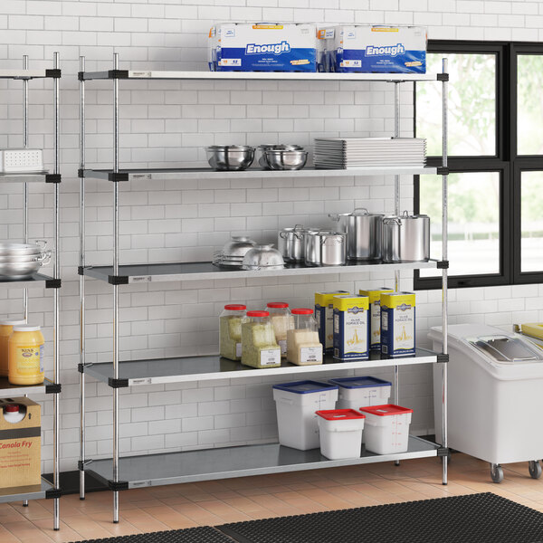 A Regency metal shelving unit in a kitchen with containers on the shelves.