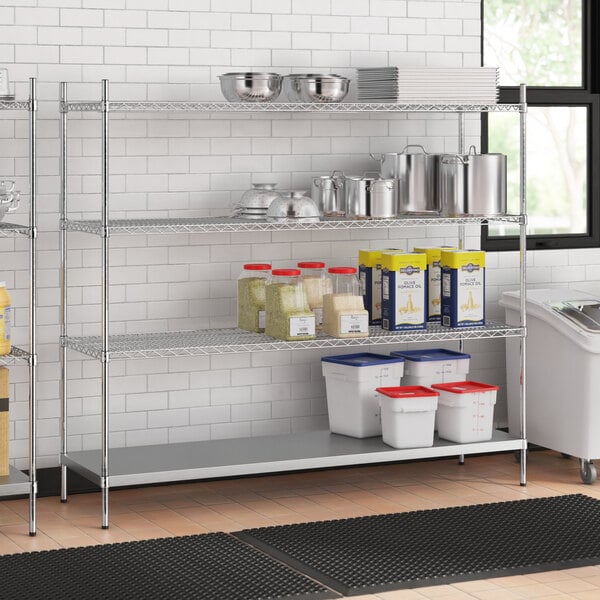 A stainless steel wire shelf unit with solid stainless steel shelves.