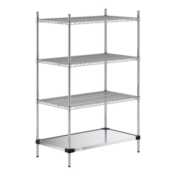 A four-tier chrome wire shelving unit with three wire shelves and one solid metal shelf at the bottom, supported by four vertical posts.