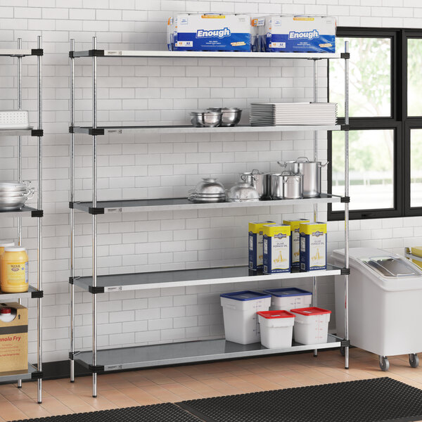 A Regency galvanized steel shelving unit in a school kitchen.