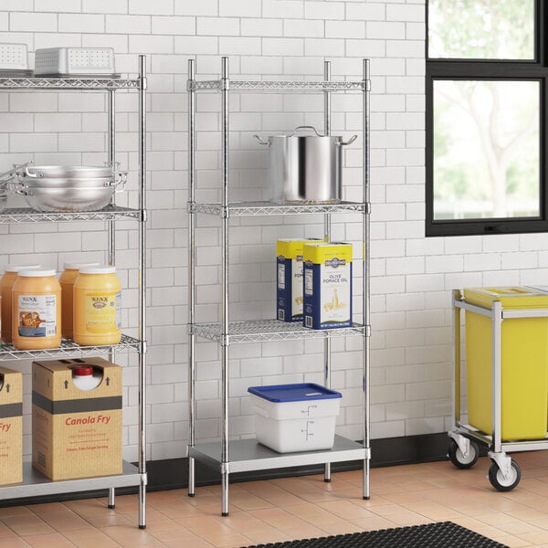 A stainless steel wire shelving unit with solid stainless steel bottom shelves holding jars of food.