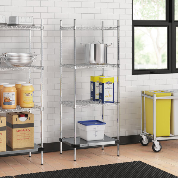 Regency chrome wire shelving unit in a professional kitchen with containers on shelves.