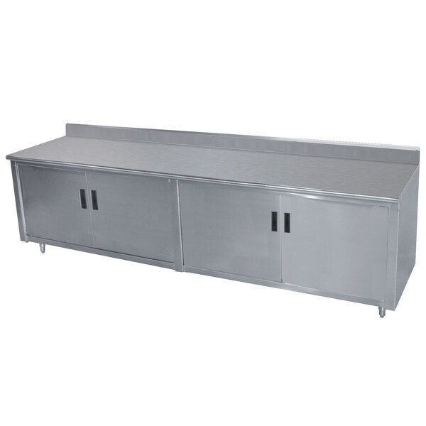 a stainless steel counter with sliding doors