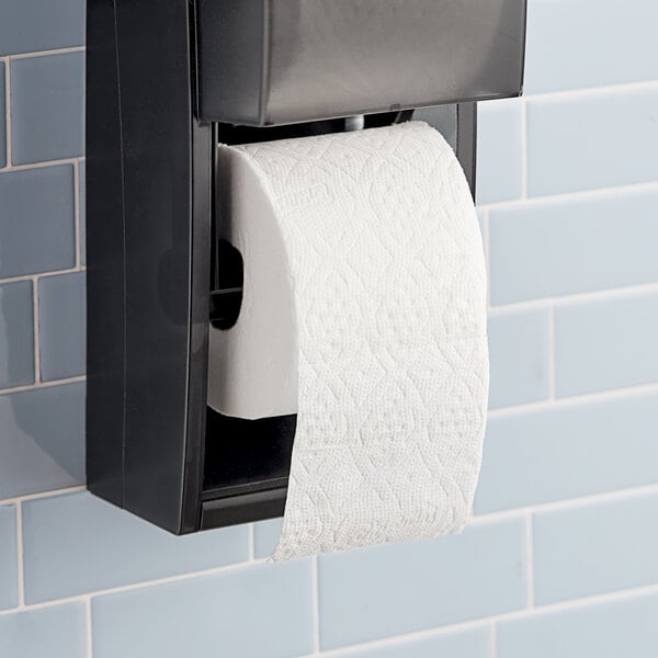 A Charmin Ultra Strong toilet paper roll on a black holder.