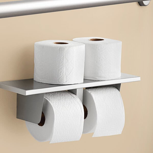 A group of Charmin Ultra Strong toilet paper rolls on a metal holder.