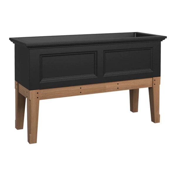 A black rectangular elevated garden bed with wooden legs.