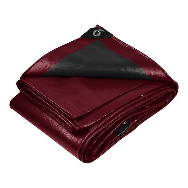 A maroon tarp with black reinforced edges folded up.