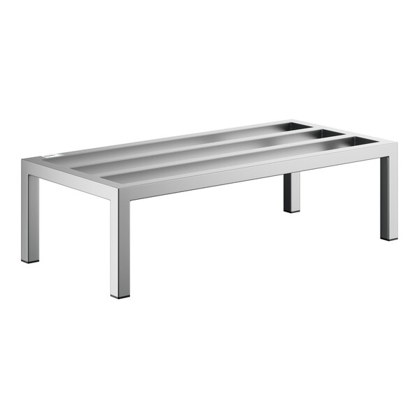 A rectangular, stainless steel rack with four legs and three recessed channels on top, designed for heavy-duty use.