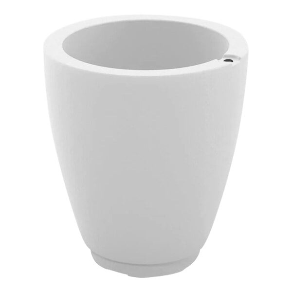 A white planter with a hole in the bottom.