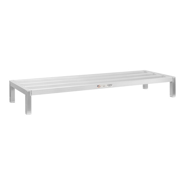 A white aluminum New Age dunnage rack with legs.