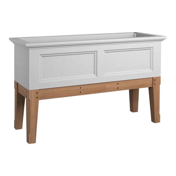 A white rectangular Mayne Fairfield garden bed with wooden legs.