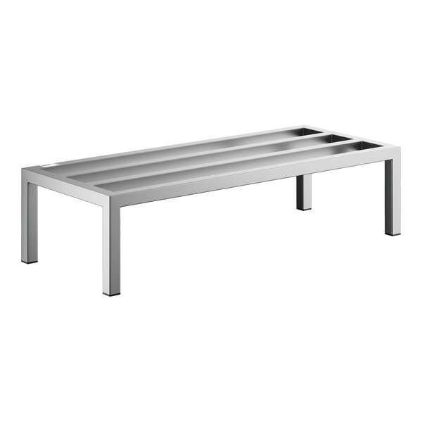 A rectangular, stainless steel rack with four legs and three recessed channels on top, designed for heavy-duty use.