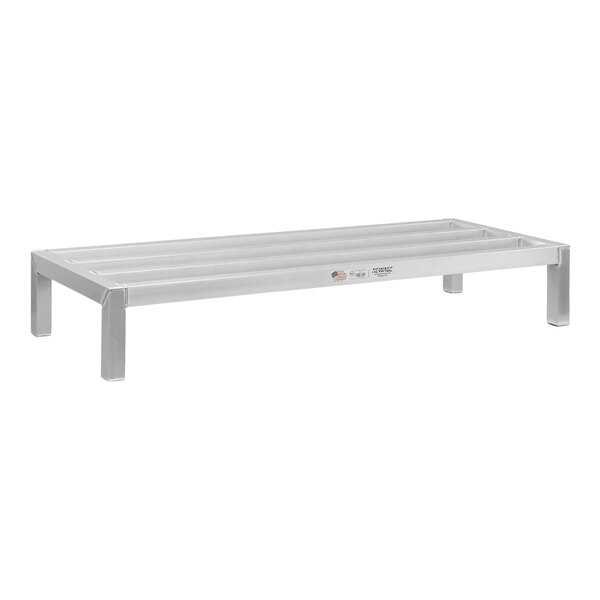 A white rectangular New Age aluminum dunnage rack with legs.