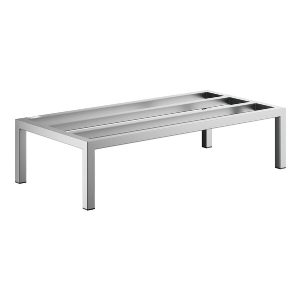 A rectangular, silver metal rack with four straight legs and an open slatted top surface.