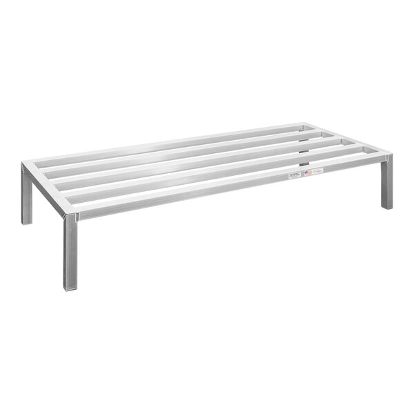 A New Age aluminum dunnage rack with metal legs.