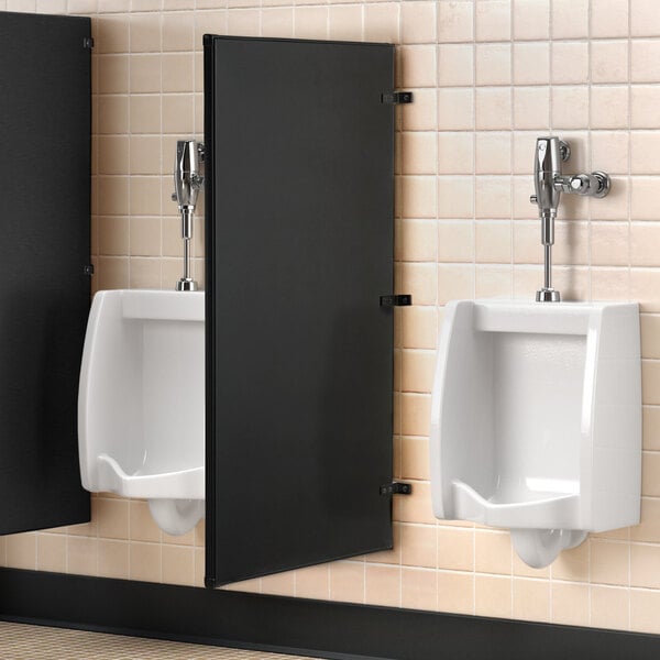 A Lavex matte black steel urinal partition on a wall.