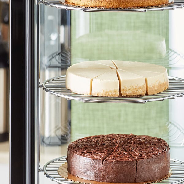 A display case with three Sirabella's pre-cut vegan cheesecakes.