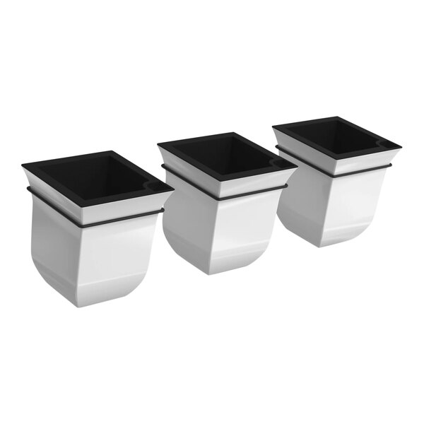 A group of white and black square planters.