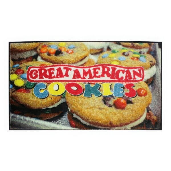 A group of cookies with a red and white sign on a brown surface.