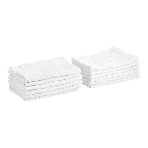 A stack of Monarch Brands white cotton ribbed terry bar towels.