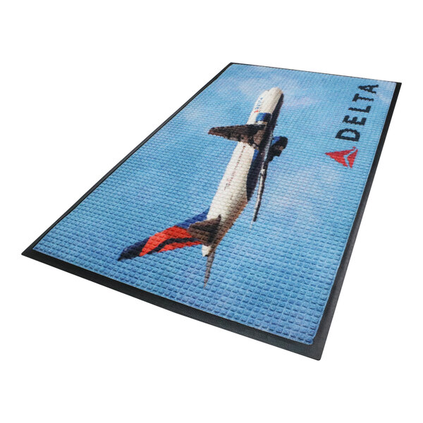 A blue and black rectangular WaterHog Impressions logo mat with a delta logo.