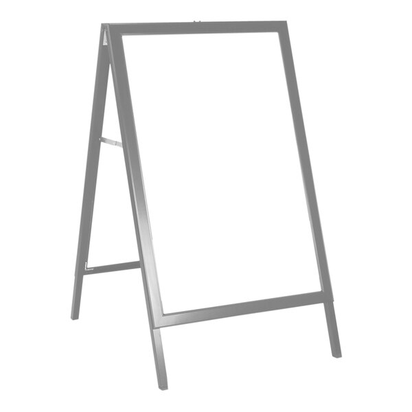 A white board with a silver frame on a stand.
