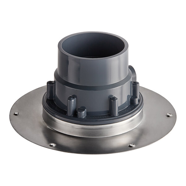 A Sioux Chief round floor drain with a round metal base and circular strainer with round and metal parts.