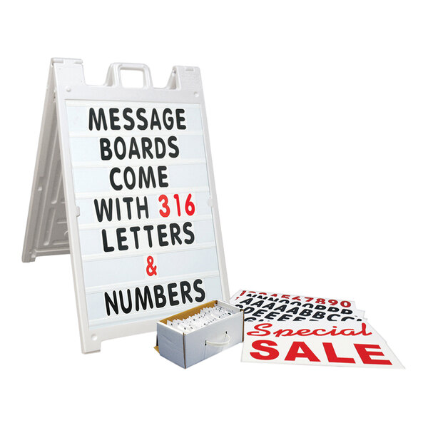 A white United Visual Products A-Frame sign with red letters reading "Message Board" and a box of cigarettes.