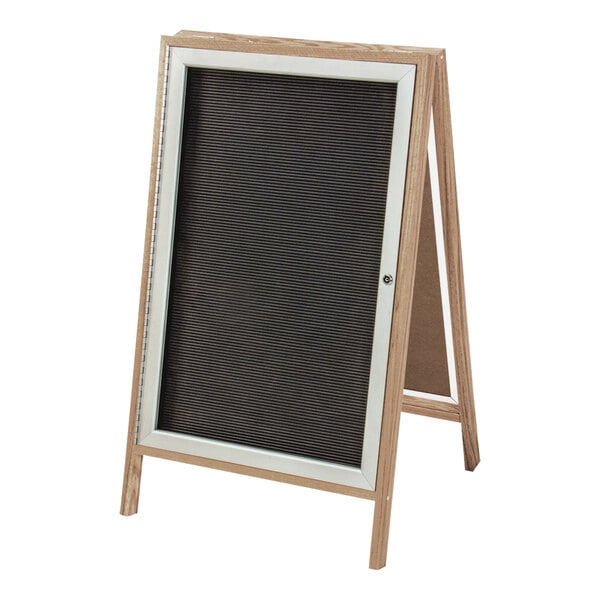 A United Visual Products black letterboard sign on a wooden A-frame stand with aluminum accents.