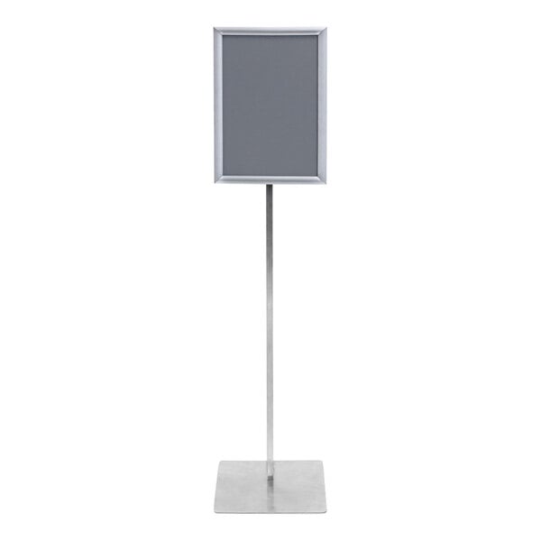 A silver pole stand with a black rectangular sign in it.