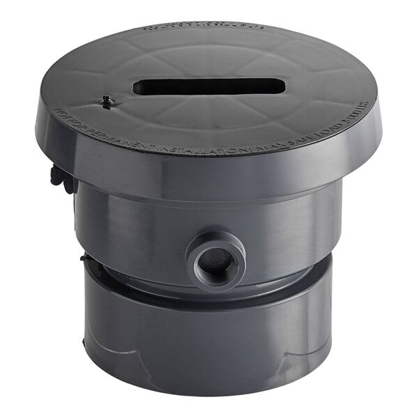 A black PVC Sioux Chief floor drain base with a circular hole in it.