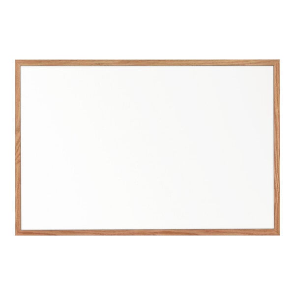 A United Visual Products whiteboard with a wooden frame.