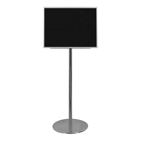 A black square sign on a metal stand with a silver pole.