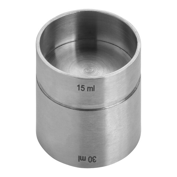 A stainless steel Tablecraft thimble jigger with measurements on it.