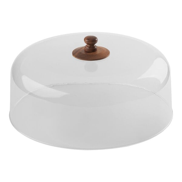 A clear glass lid with a wooden knob.