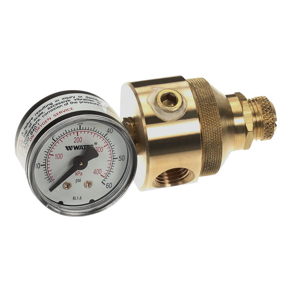 A close-up of a Pitco pressure gauge with a brass finish.