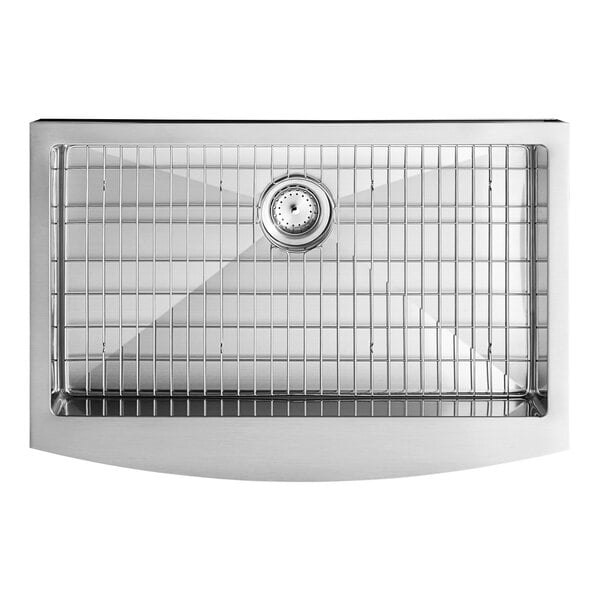 An American Standard stainless steel farmhouse sink with a grid on the side.