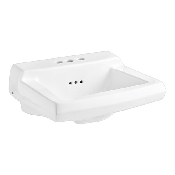 A white American Standard wall-mount bathroom sink with three holes.
