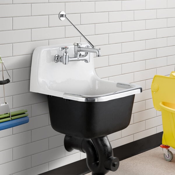 An American Standard Lakewell wall-mount utility sink with a faucet and cleaning equipment.