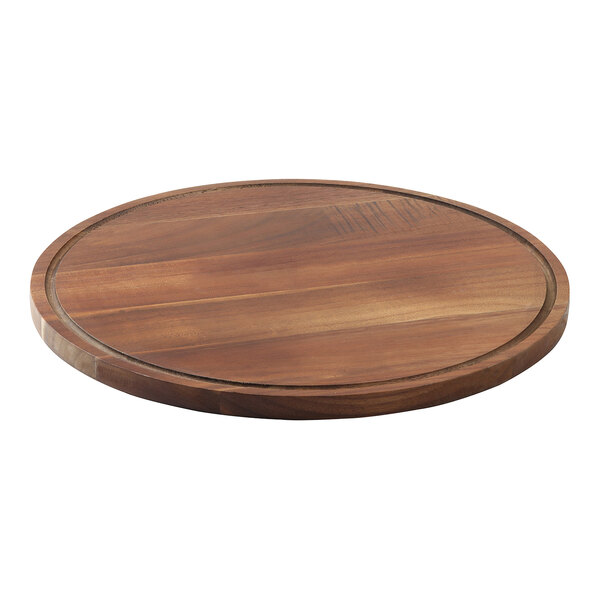 A Tablecraft round acacia wood cake plate with a round edge.