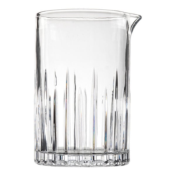 A Tablecraft clear glass stirring glass with a straight edge and a spout.