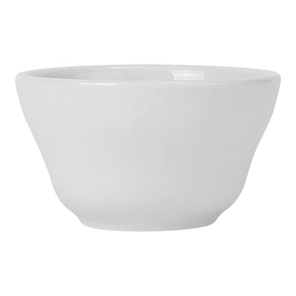 A Tuxton white porcelain china bowl with a small handle.