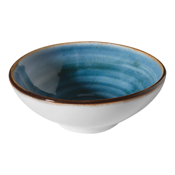 A blue bowl with brown specks on the rim.