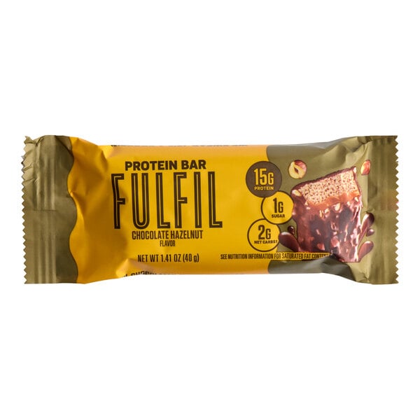 A FULFIL chocolate hazelnut flavor protein bar in a yellow and brown wrapper.