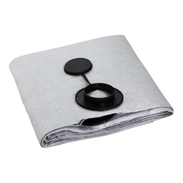 A folded grey cloth with a black circle on it.