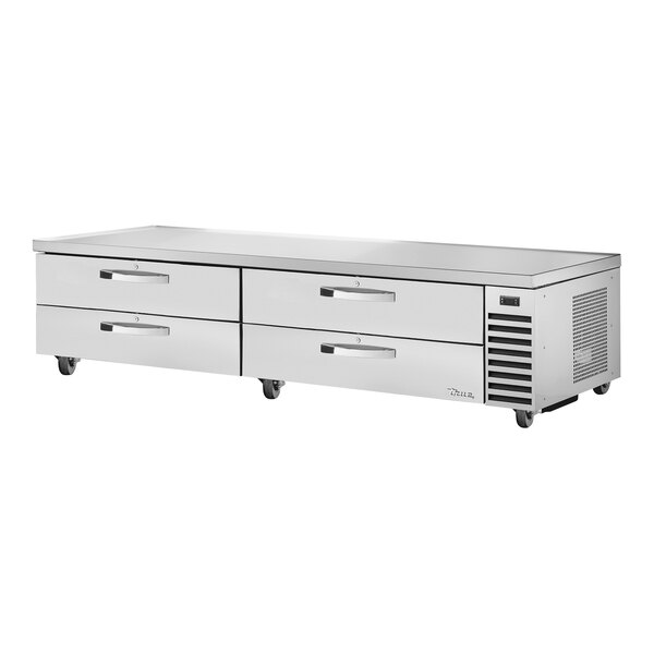 A stainless steel True refrigerated chef base with 4 drawers.