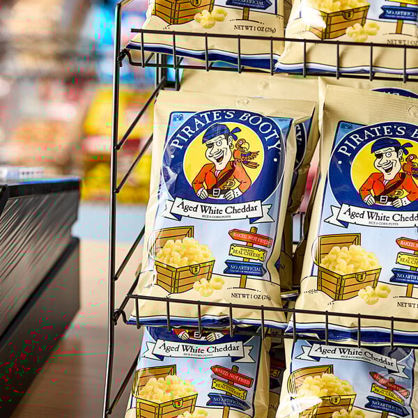 A rack of Pirate's Booty white cheddar rice and corn puffs bags.
